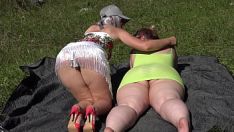 Play Mature lesbian with a strapon fucks a fat bisexual girlfriend outdoors in a public park. two big asses in nature. pawg. amateur fetish. milfs.